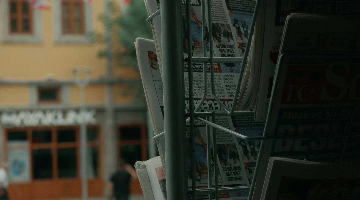 A newspaper stand on a street